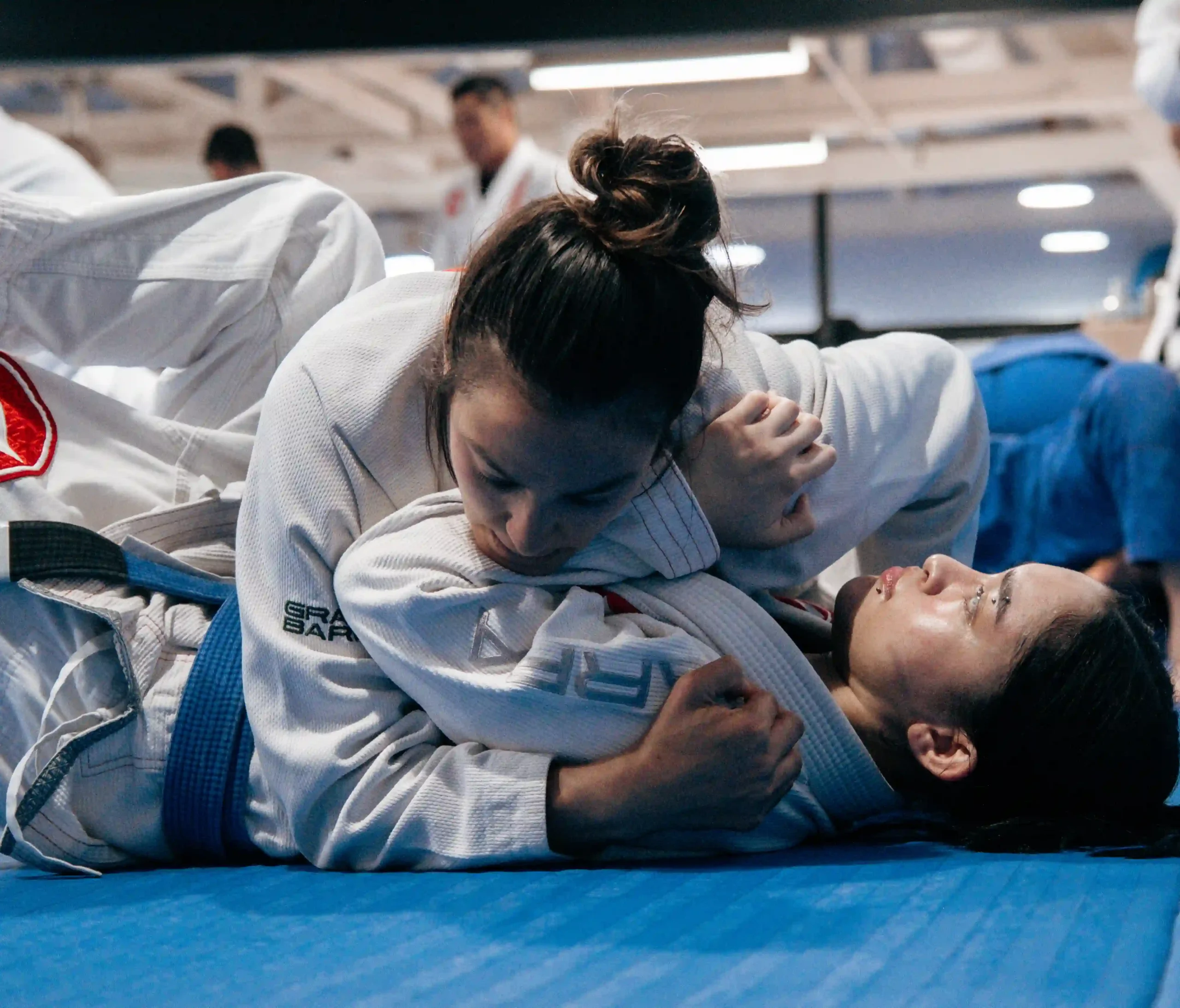 Gracie Barra Long Beach, CA - Jiu-Jitsu & Self-Defense 3 Smiling student holding side control on a training partner
