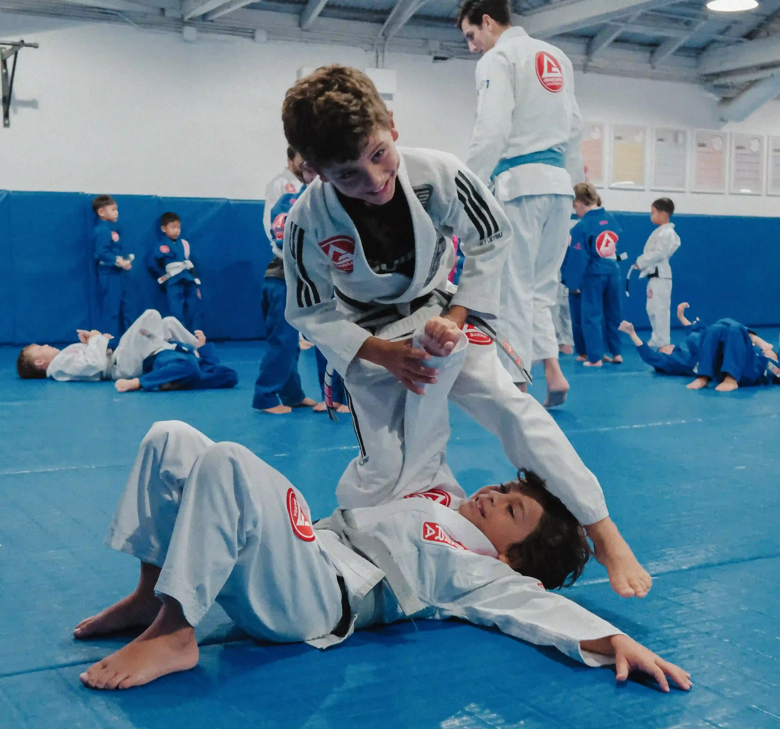 Gracie Barra Long Beach, CA - Jiu-Jitsu & Self-Defense 2 Young Gracie Barra Long Beach student stretching on the mats
